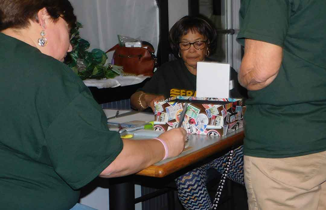 Volunteer helping with registration