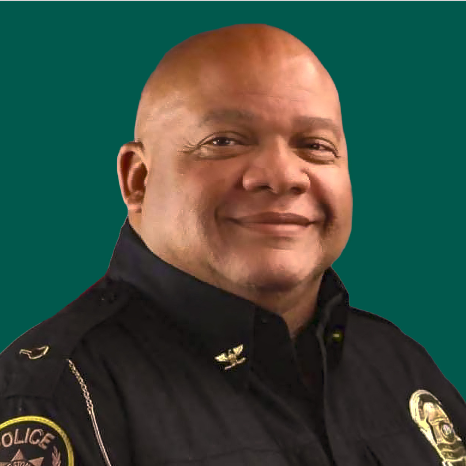 Franklin Moore, candidate for Rockingham County Image of Frank in his Chief of police uniform seated and smiling warmly