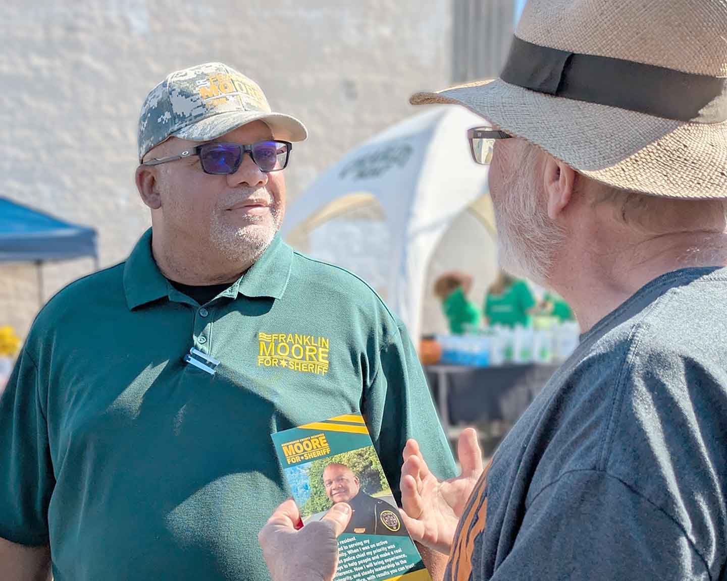 Frank speaking one-on-one with a community member