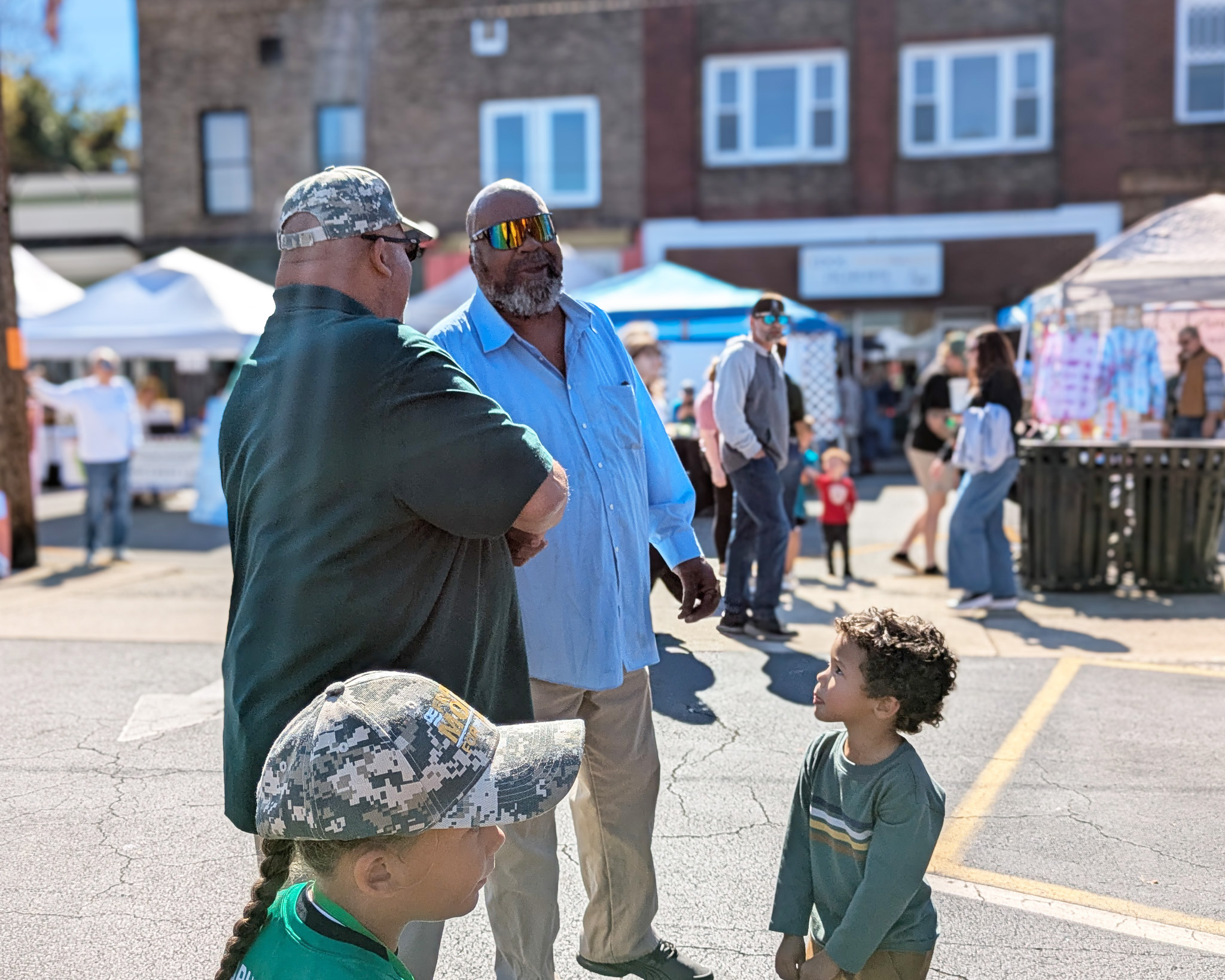 Frank shaking hands with a voter at the Madison Fall Festival