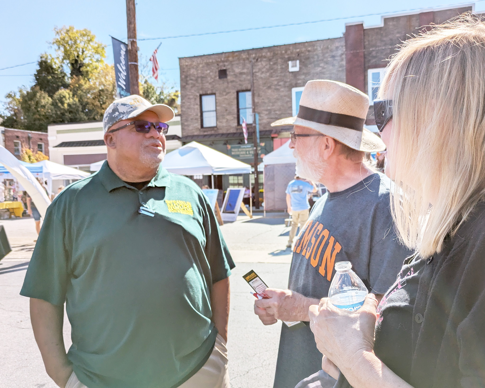 Frank engaging with community members at the festival