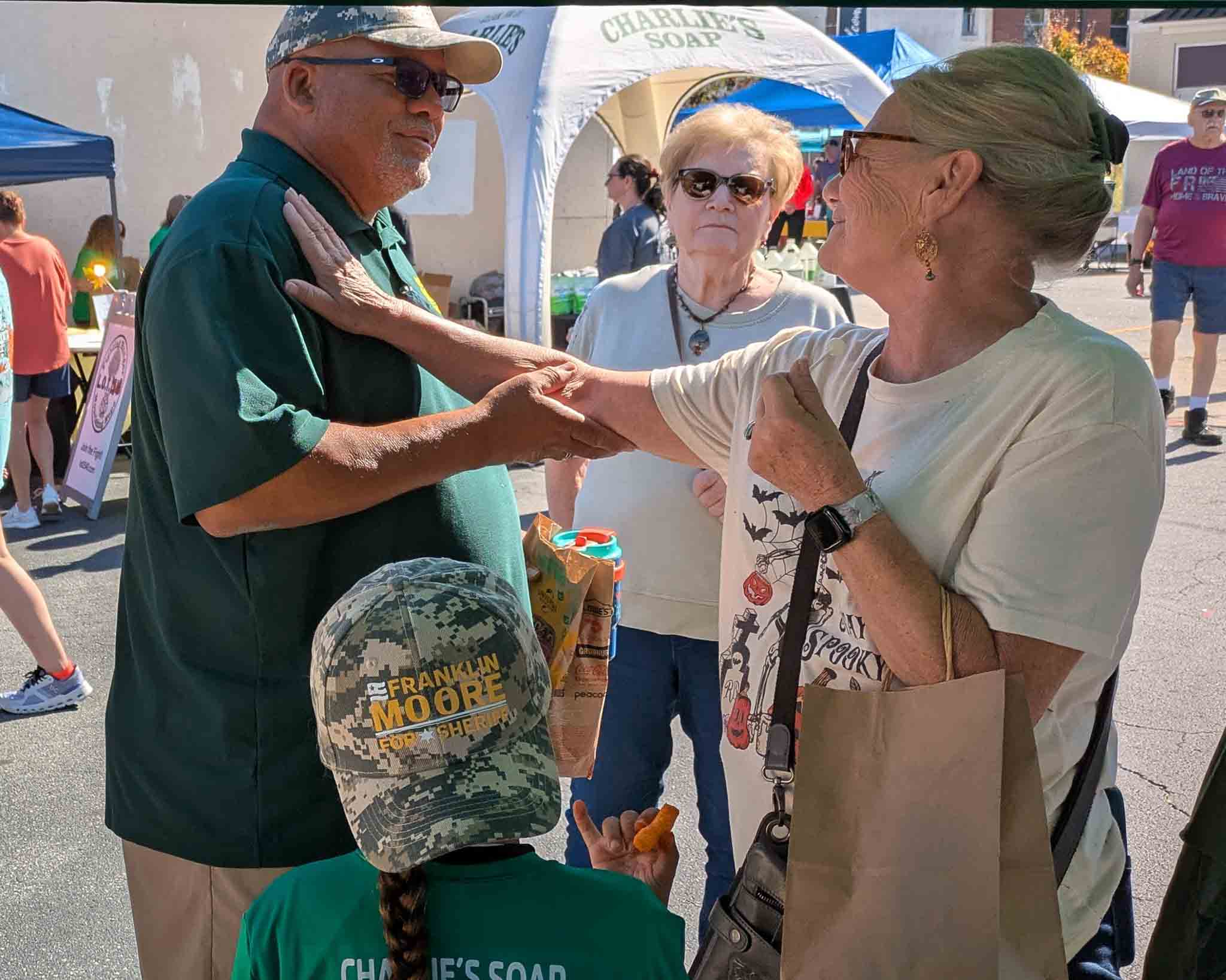 Frank meeting with voters at the Madison Fall Festival