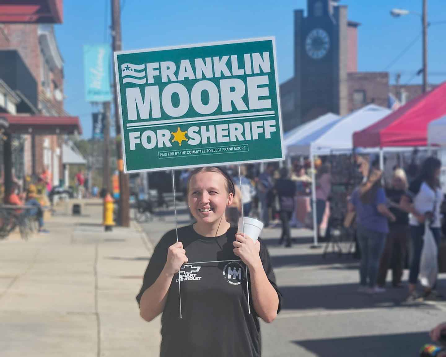 Madison Fall Festival — Franklin Moore with a supporter holding a yard sign