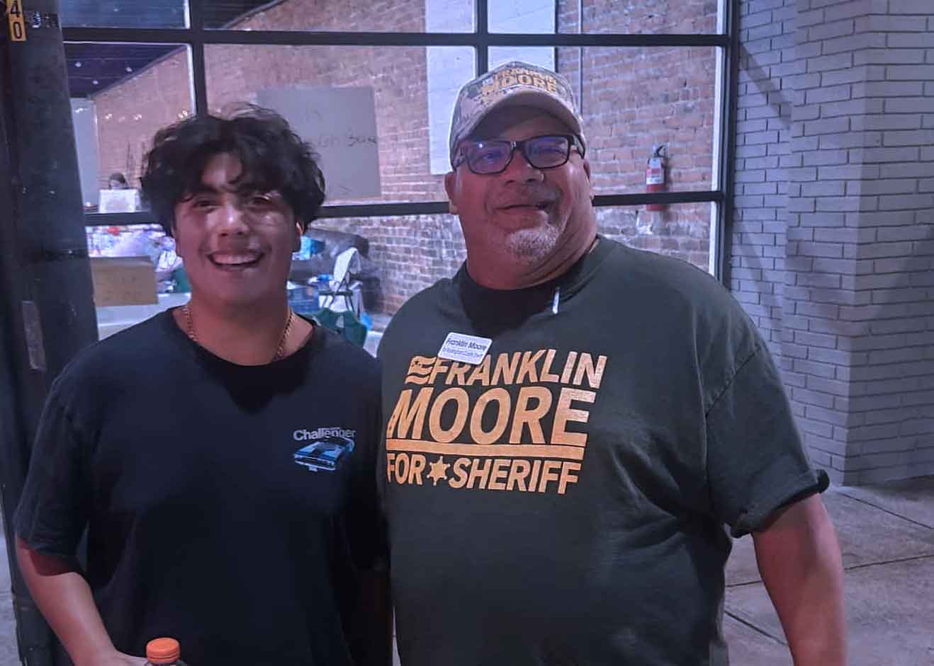 Frank Moore connecting with young community members at Riverfest