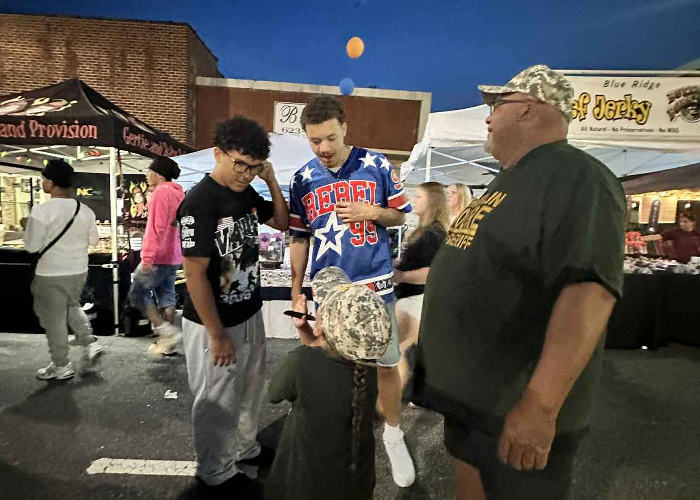Frank and Kai Moore spending time with friends at the festival