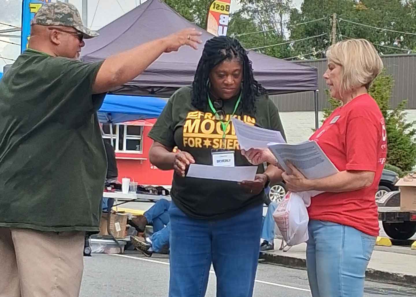 Frank speaking with a group of community members at Stoneville Fall Festival