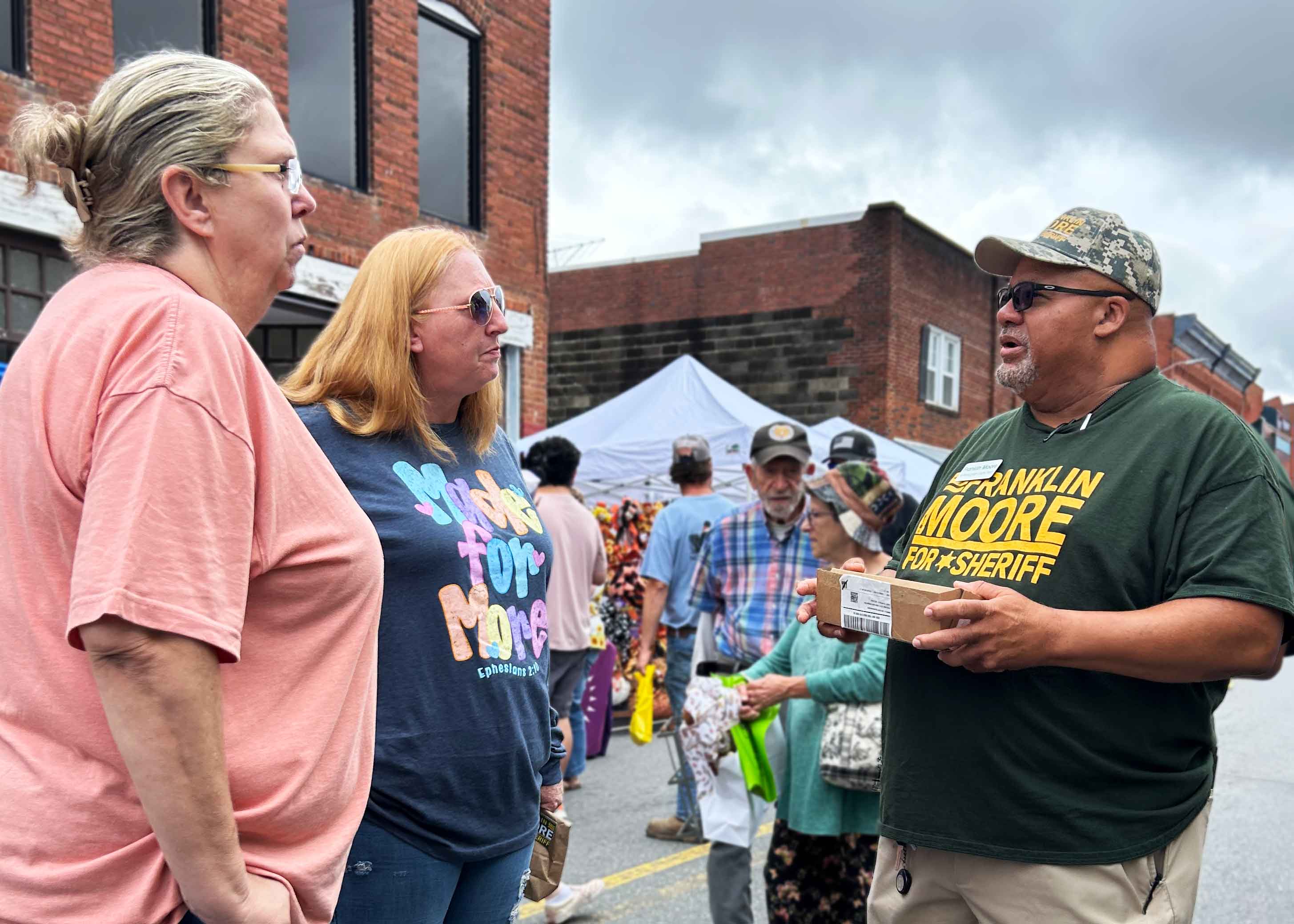 Frank Moore engaging with voters at the festival