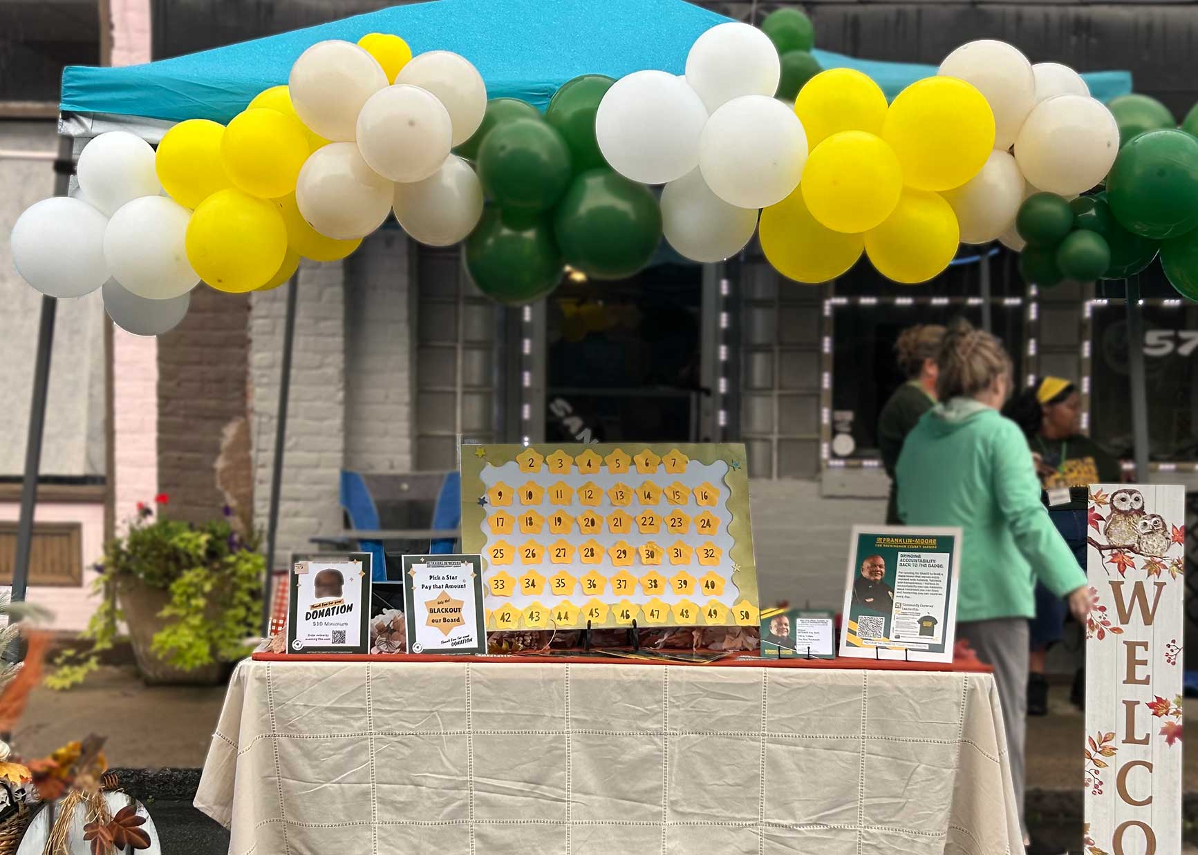 Campaign information booth setup at the festival